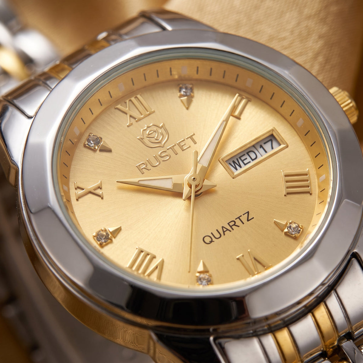 Zeldior RUSTET Women's Two-Tone Gold Dial Watch face close-up with crystal hour markers